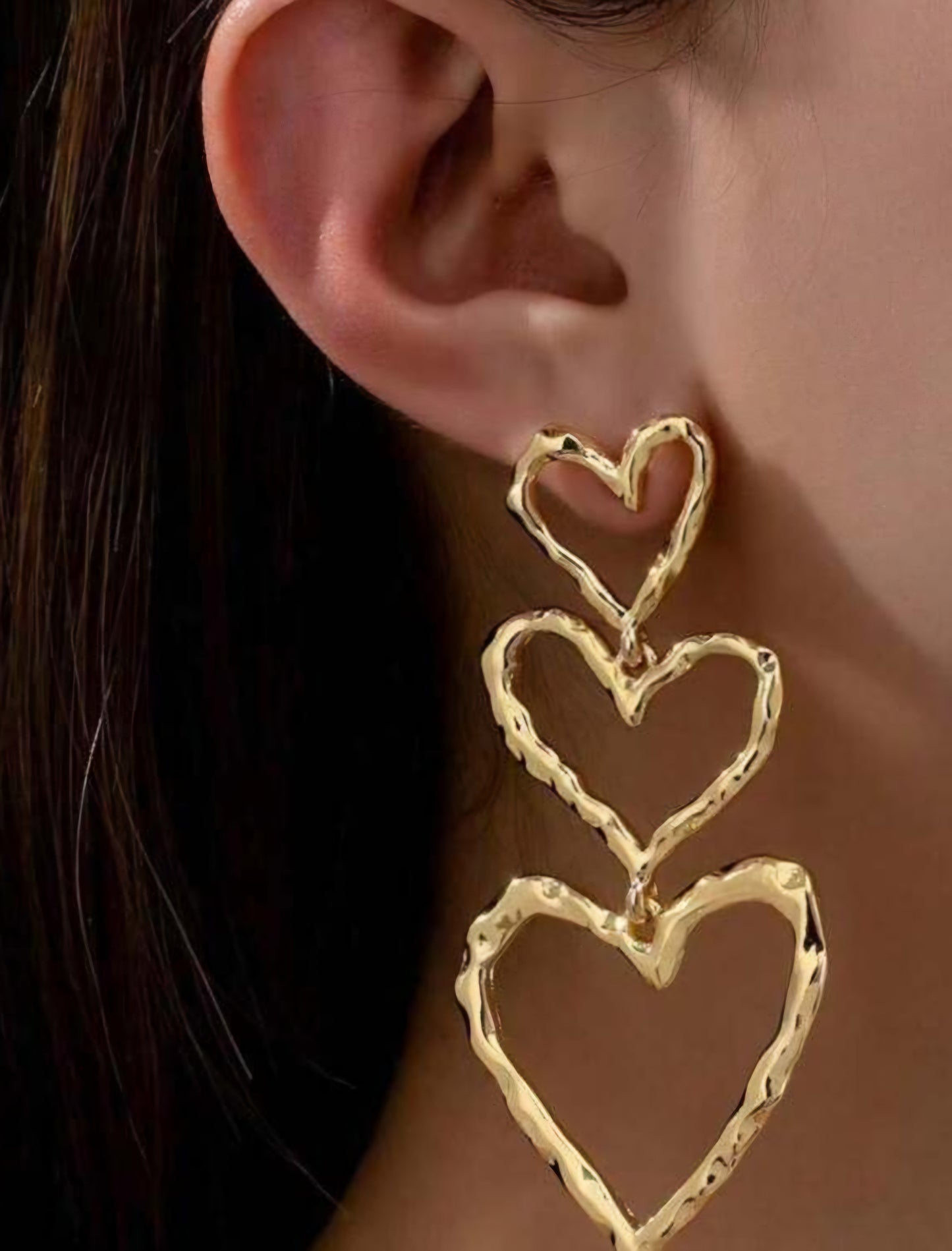 Gold heart dangle earrings